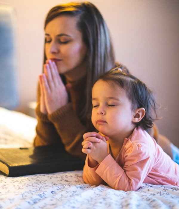 Build stronger, Christ-centered relationships with Christian-based counseling. A mother teaches her daughter about prayer time.