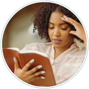 A woman enjoys reading her bible with a clear mind thanks to Christian counseling at Palmetto Counseling.